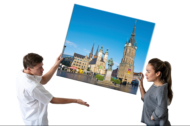 blank frame being hung by couple d